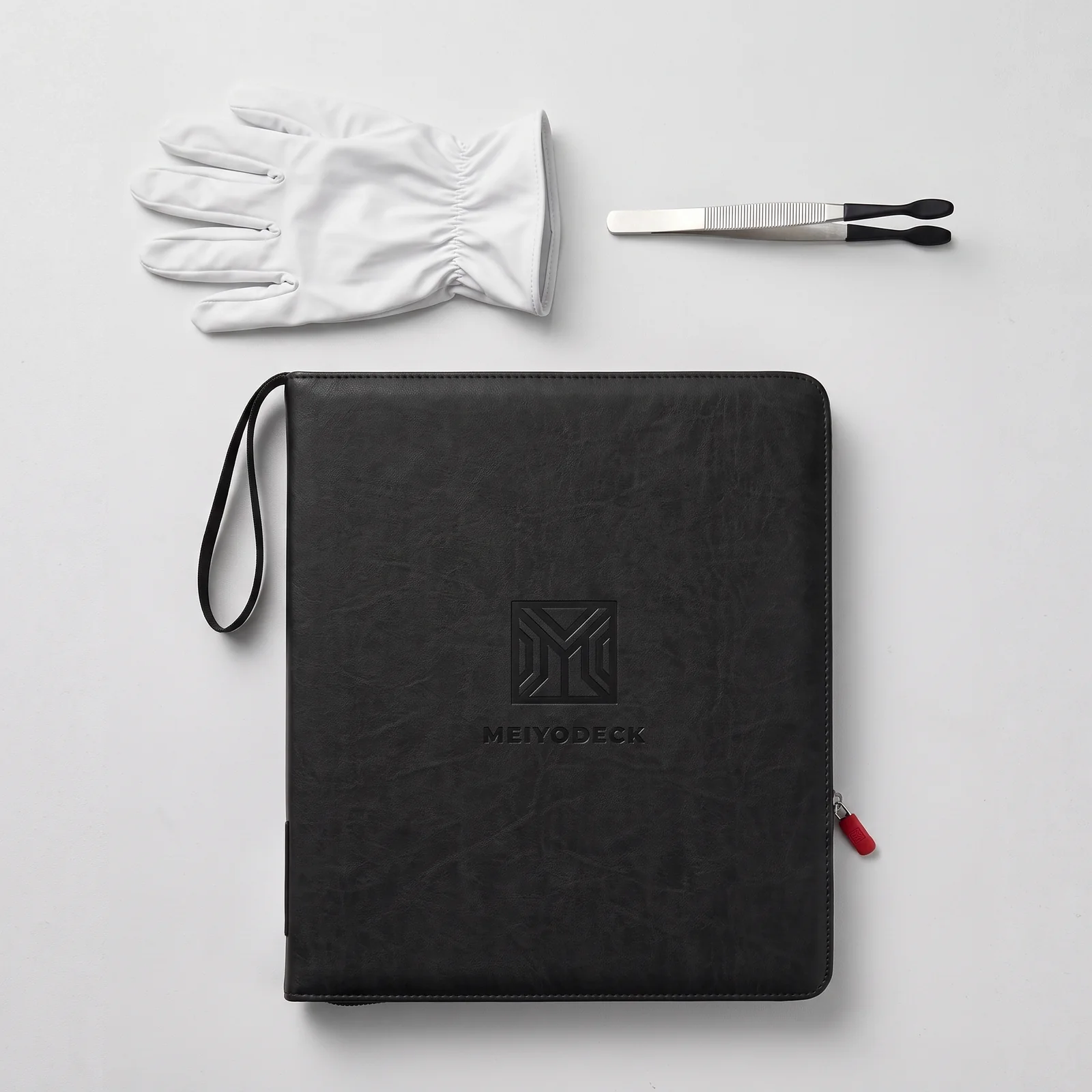 Meiyodeck binder with the included white cotton gloves and silicone-tipped tweezers